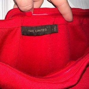 Red strapless, just below the knee, dress from The Limited. Zip down side.